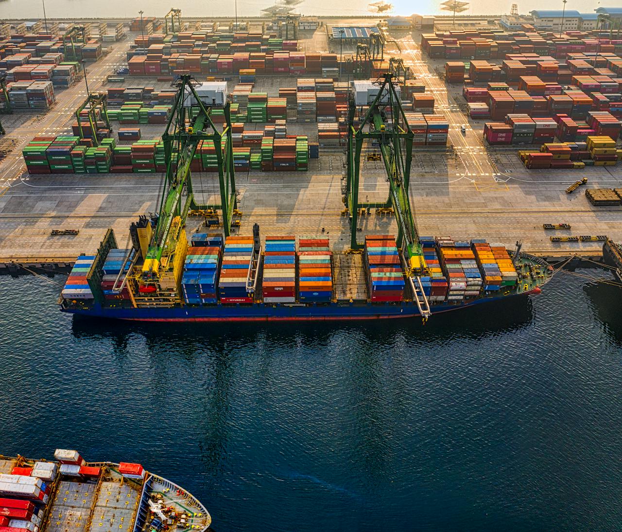 stats-img Aerial shot of colorful shipping containers at North Jakarta's bustling port, Indonesia.